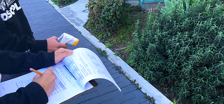 teens participating in a urban heat island effect exercise by the Robertson Branch Library