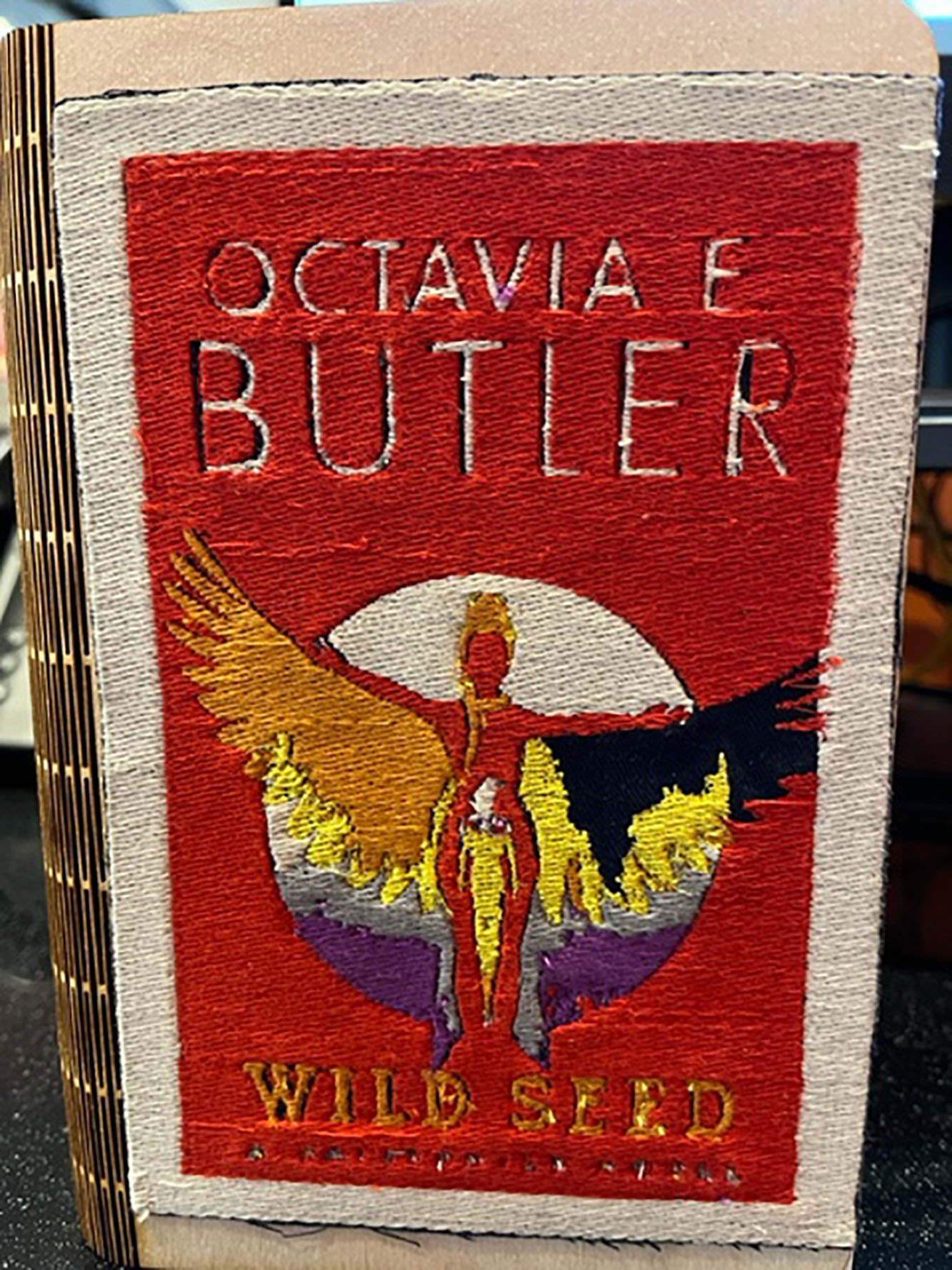 embroidered cover of wild seed