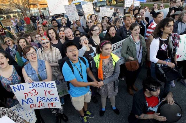 Protesters march against HB2 on West Franklin Street in Chapel Hill, NC Tuesday afternoon, March 29, 2016. Photo by Elena Boffetta, The News & Observer.