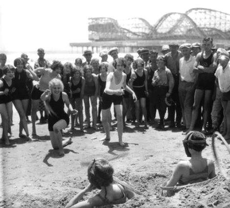 two young ladies tossing their hoops at two others 1925