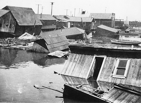 shacks built by squatters and damaged by a storm