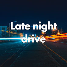 a photograph of car lights passing by at night while driving