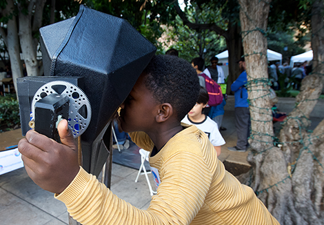 Child looking through perceptoscope