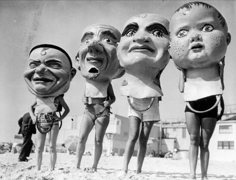 giant paper mache heads on Venice Beach