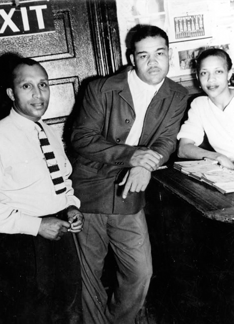 Boxer Joe Louis (center) poses with a woman and Gordon Sheppard in Shepps’ Playhouse