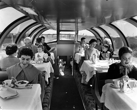 people on a train in a dining car