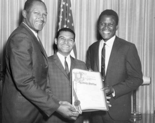 	Los Angeles City Council representatives Tom Bradley and Billy Mills present a proclamation honoring actor Sidney Poitier.