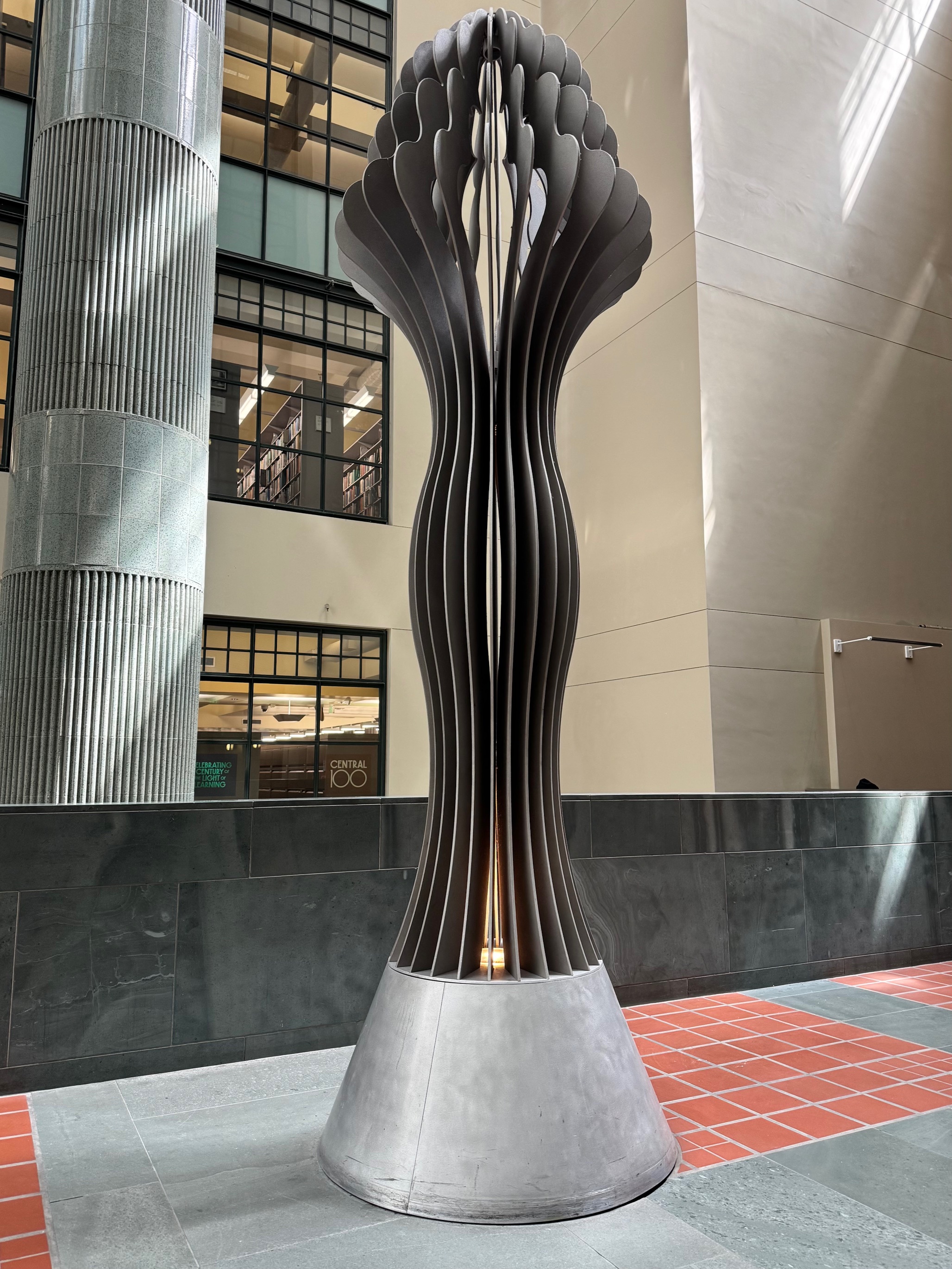grey torch sculpture in Central Library
