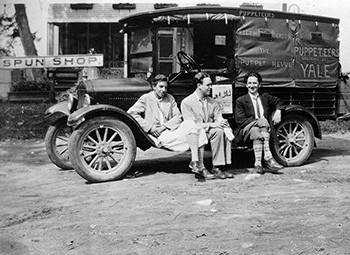 b/w photo of the Yale Puppeteers on the road in New Hampshire in from of covered wagon