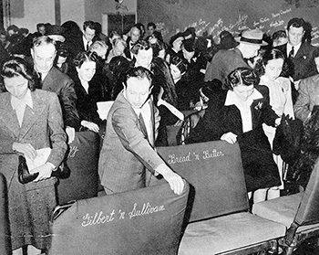 b/w photo of theatre with crowd patrons