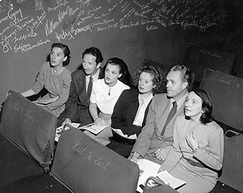 b/w photo of the four women and two men who were Turnabout Theatre mainstays reacting to performance