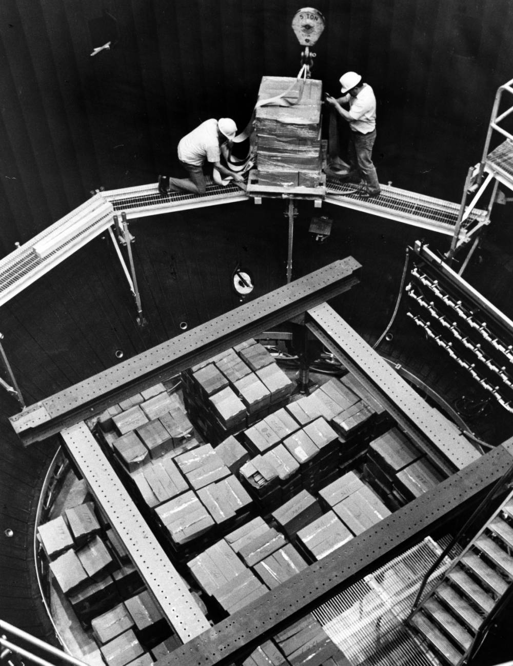 Boxes of books loaded into a chamber