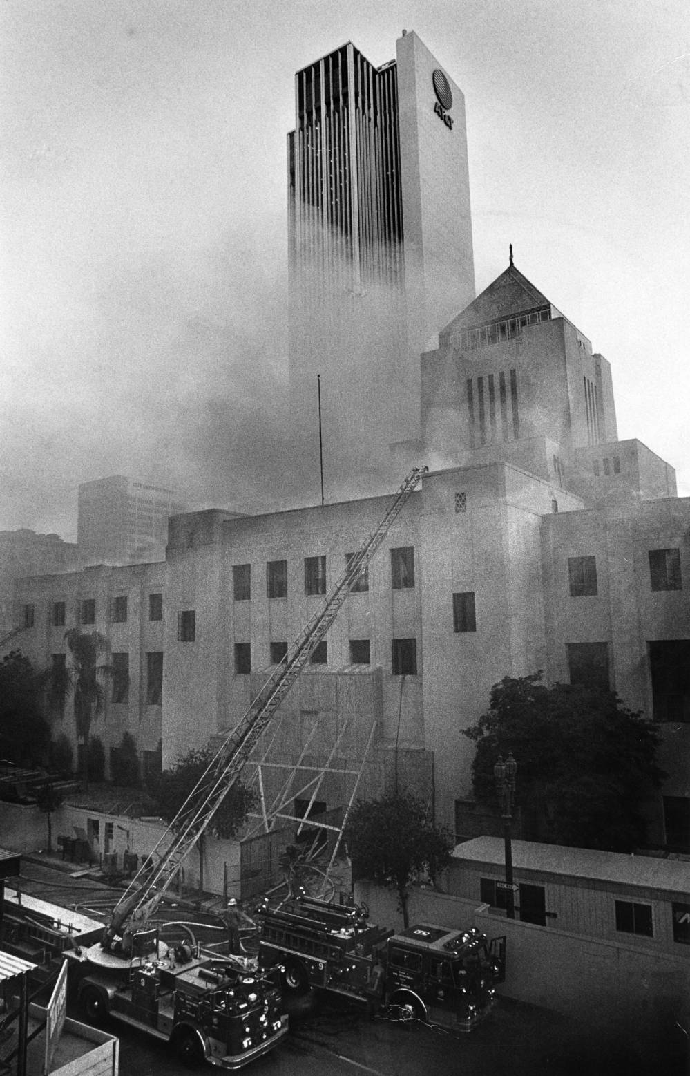Central Library with smoke coming out of it. Firetruck and ladder are outside
