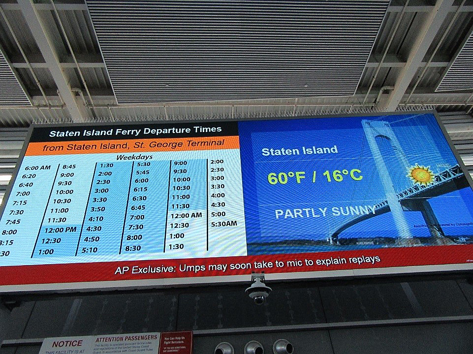 a digital display of the staten island ferry departure schedule