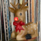 record wall with a giant Rudolph ornament in front