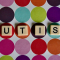 Scrabble tiles spelling out the word AUTISM