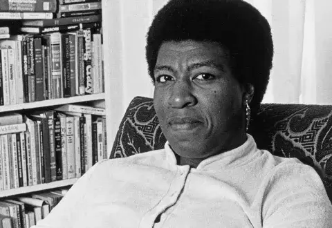 Author Octavia Butler in a room with books