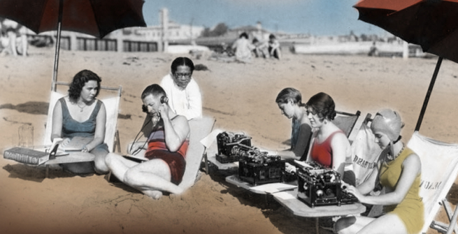 1934 colorized picture of people at the beach with typewriters