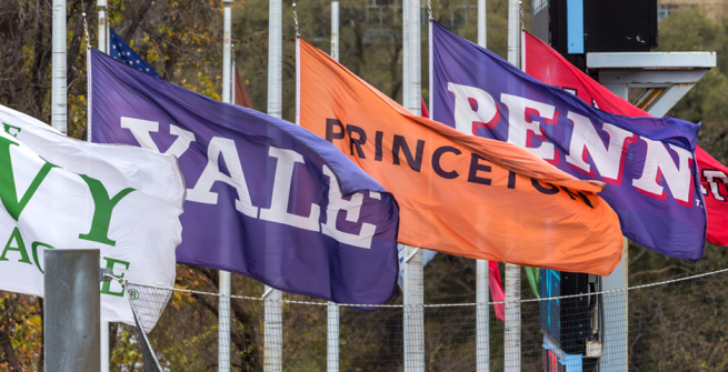Flags of the Ivy League Universities fly over Columbia's Wien Stadium