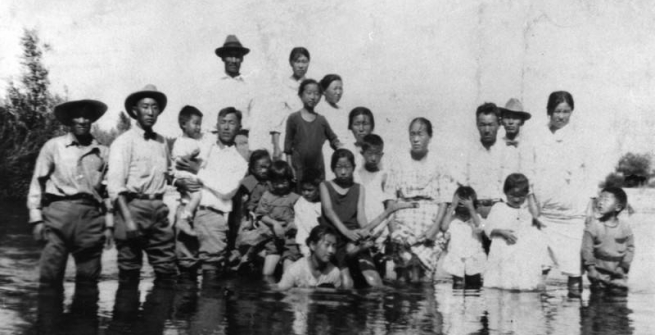 Korean American family at river, ca 1900