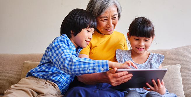 Grandma and kids reading together