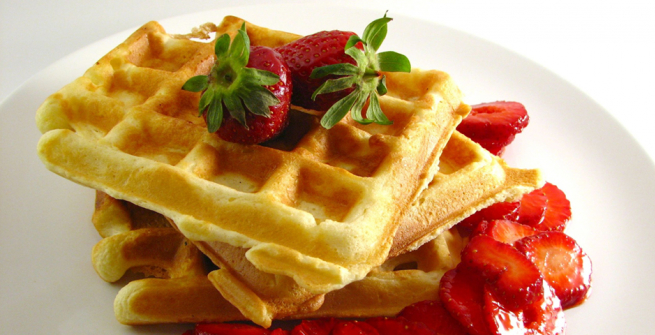 waffle with syrup and strawberries