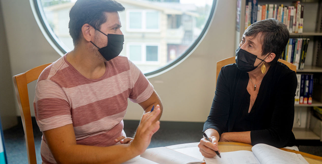 Cesar with Laurie, an adult literacy tutor