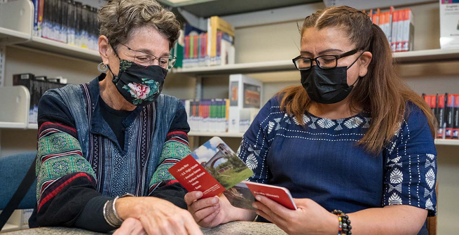 Tutor helps adult learner study for her US Citizenship