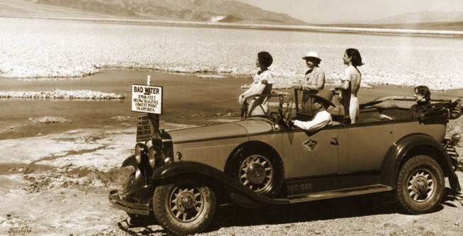 Tourists viewing Badwater in Death Valley from their car