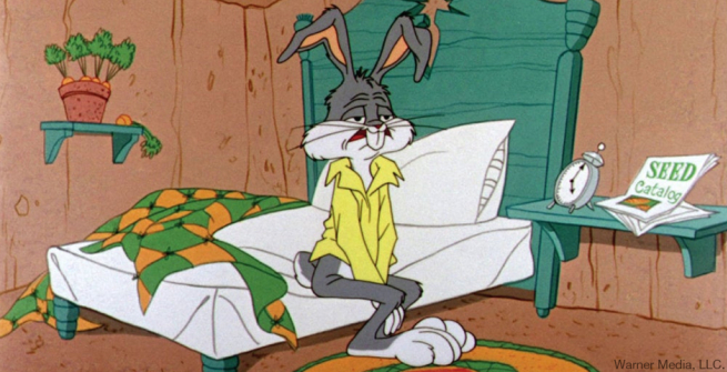 a very sleepy bugs bunny getting out of bed