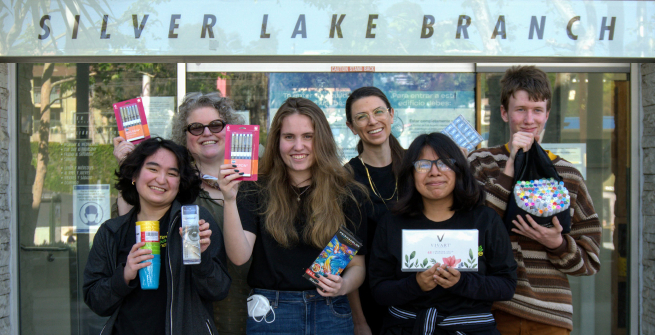 teens holding art supplies in front of the Silverlake Branch Library