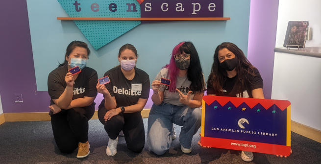 Teen’Scape sign with Michelle, Ashley, Julia, and a teen volunteer