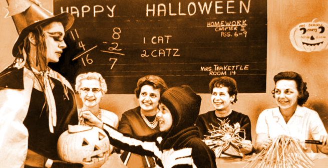 Judy Aldrich, 8, receives pumpkin treat from Donna Lewis