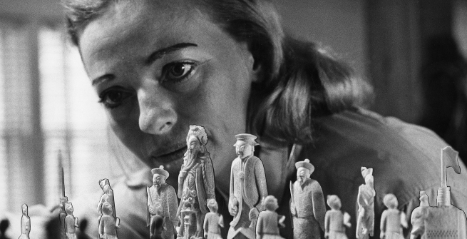 close up of woman staring at a chess board
