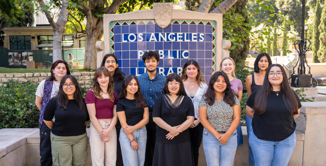 daia students in front of the central library sign