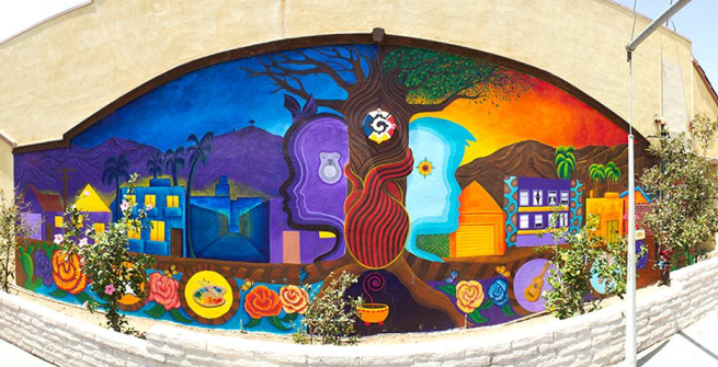 Tia Chucha's Cultural Center & Bookstore's mural depicting the tree of life, the masculine/feminine generating principles of the world, and the wholeness of self, community, earth, and spirit.