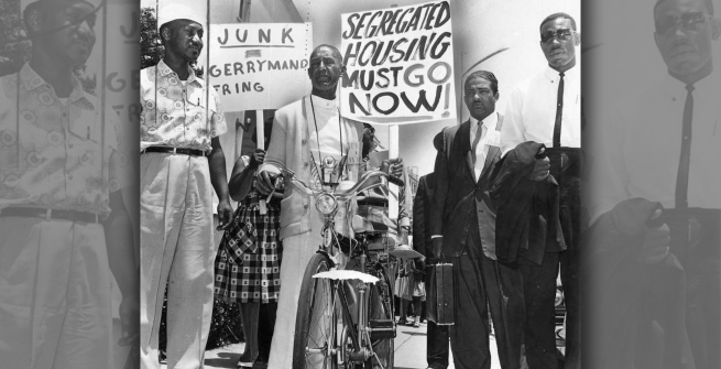 Wright travels on a bicycle to take part in march