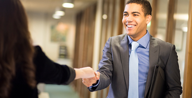 man shaking a hand of another business person after an interview