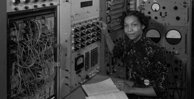 woman in front of phone operator board