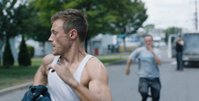 young man in tank top running away from another man