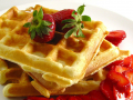waffle with syrup and strawberries