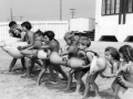 Children at the beach with floatie toys