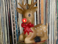 record wall with a giant Rudolph ornament in front