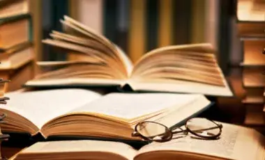 open books and a pair of eyeglasses