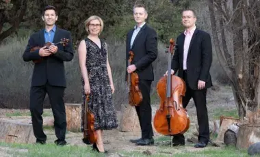 Picture of the Fiato Quartet holding their string instruments