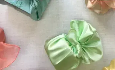 small box wrapped in pale green cloth 