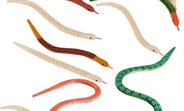Painted and unfinished wooden snakes