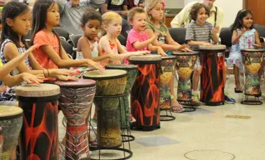children playing conga drums