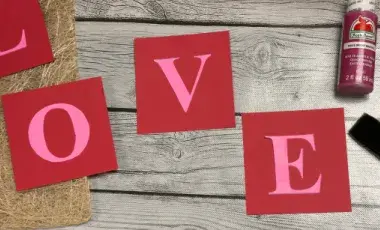 Love Sign on a red painted square