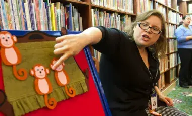 A woman sharing a monkey flannel story